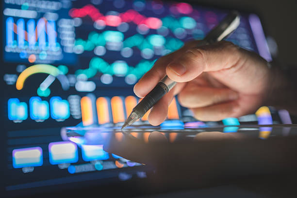 istock ai-driven tele-finance analytics hand pointing at glowing digital investment charts for smart business decisions 2225723011