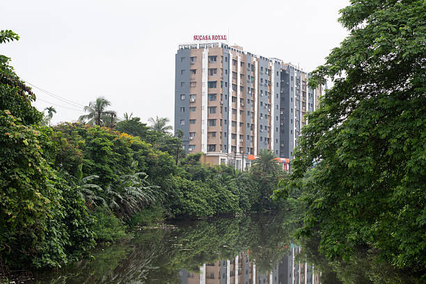 southern bypass, kolkata, west bengal, india - july 18, 2025 : residential building complex along the canal with surrounding greenery