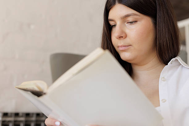 istock Pregnant young woman,  reading a book. 2225737323
