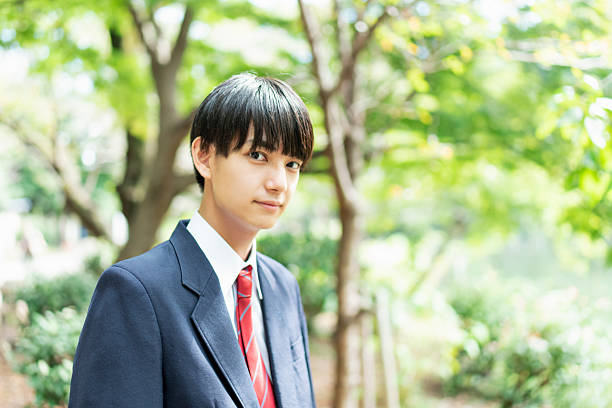istock High school boys in a park in autumn 2225742323