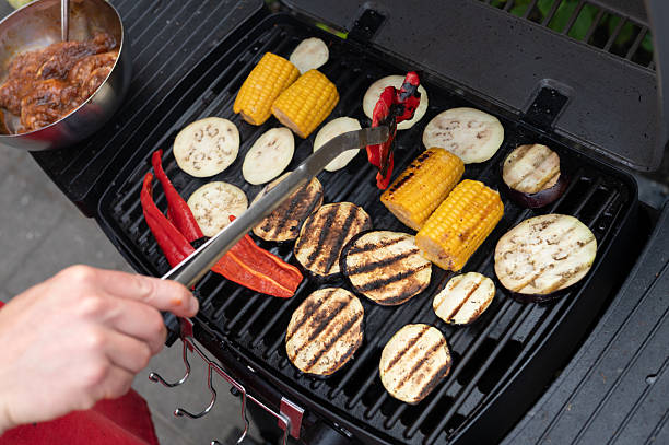 istock Grilled vegetables on barbecue with bell peppers and corn on the cob 2225742569