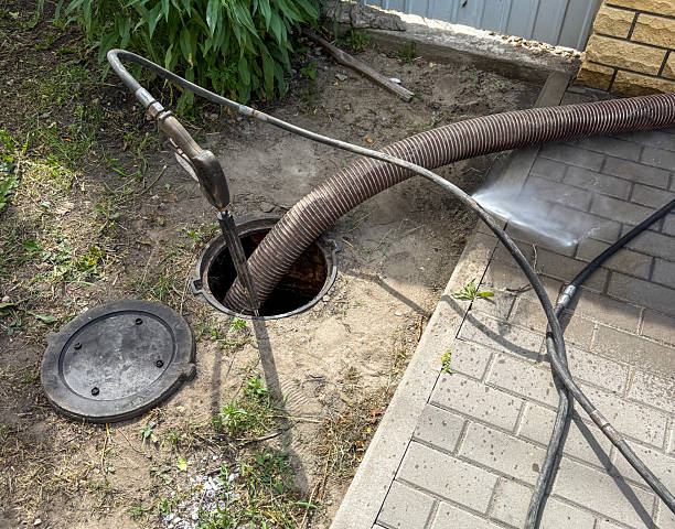 istock A hose is being used to clean a drain 2225743357