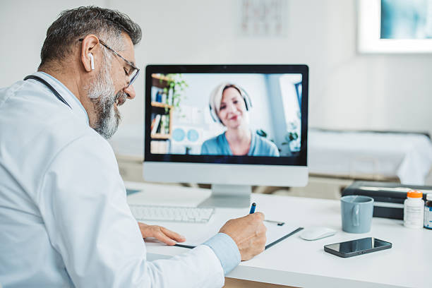 istock Doctor meeting remotely with his patient 2225745560