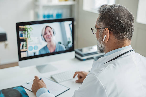 istock Doctor meeting remotely with his patient 2225745561