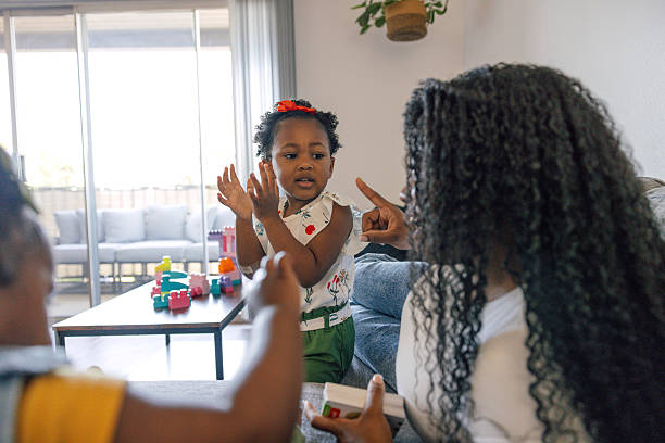 istock Single mother playing with her two daughters at home 2225745935