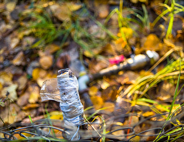 a water supply hose wrapped with adhesive tape, outdoor closeup