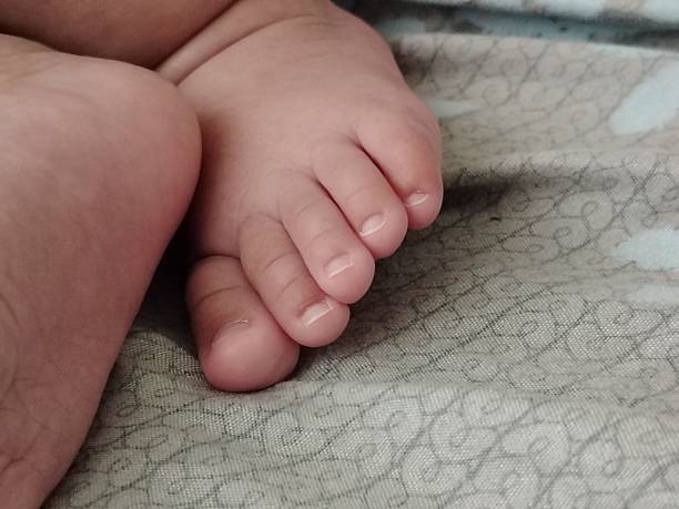 Close up bare foot and feathers, relax concept. Lying and enjoying rest.