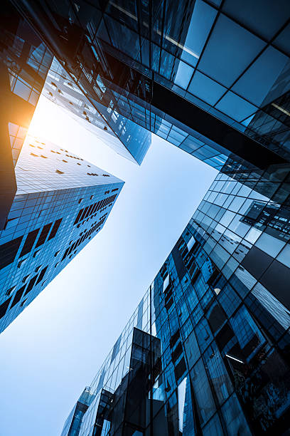 istock Dynamic View of Modern Glass Architecture Against a Bright Sky 2225749880
