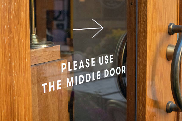 istock Please use the middle door sign 2225750298