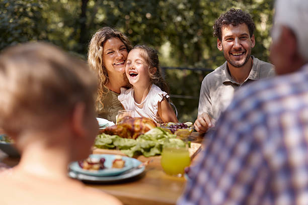 istock Happy family enjoying while having lunch on a terrace. 2225753688