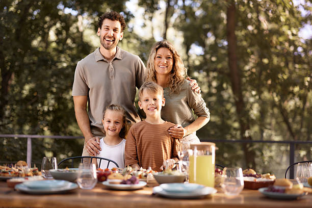 istock Happy family enjoying before a meal on a patio. 2225754438