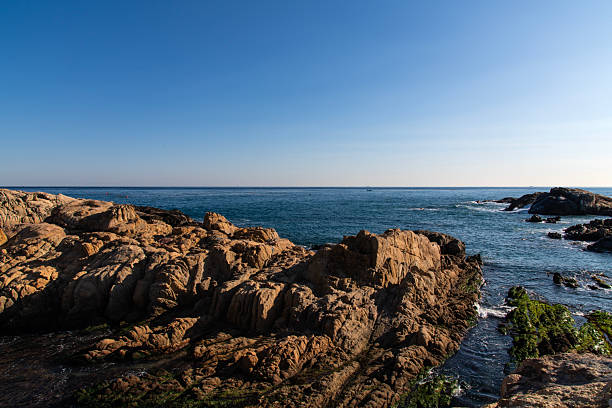 istock rocks on the sea 2225755197