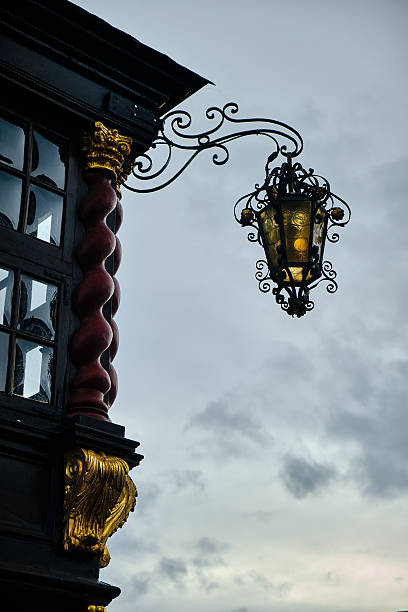 istock Ornate lantern and historical building facade at dusk, Aachen, Germany 2225755464