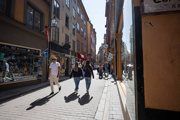 Stockholm, Sweden - June 22, 2025: Crowd of people walking around Gamla Stan area.