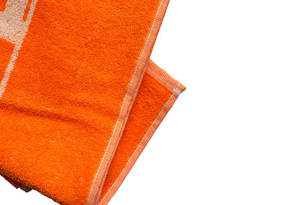istock Orange towel on white background, soft bath textile or beach accessory, top view 2225756187