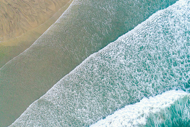 istock Summer Vacation Scene with Crashing Waves from a Drone, aerial drone top down view zenithal 2225756870