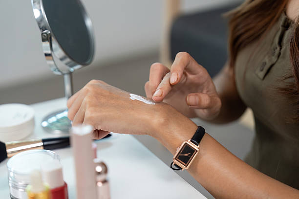 istock Skincare Application. Woman testing cream on her wrist at home. 2225759227