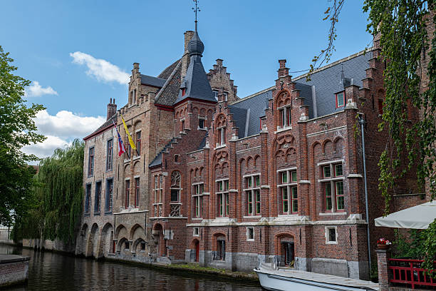 istock With its canal views, arched windows, and national flags, this classic brick building reflects the charm of European heritage. 2225760536
