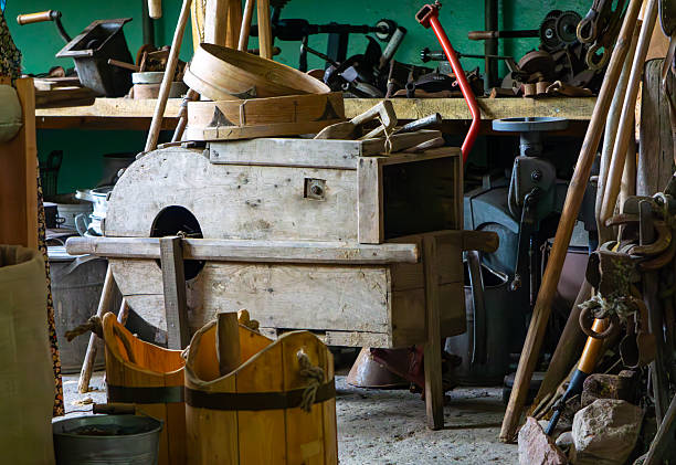 Relics of vintage equipment nestled within a late 19th century horse stable