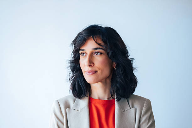 Confident Professional Woman in Modern Attire Looking Forward