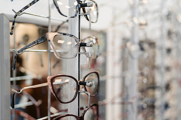 Prescription glasses on the shelfs in an optical shop.