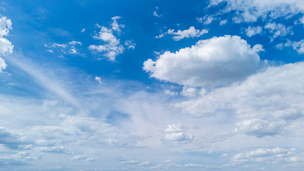 istock A serene blue sky filled with white fluffy clouds creates a tranquil atmosphere. Ideal for backgrounds, nature-themed projects, or seasonal contexts. 2225773276