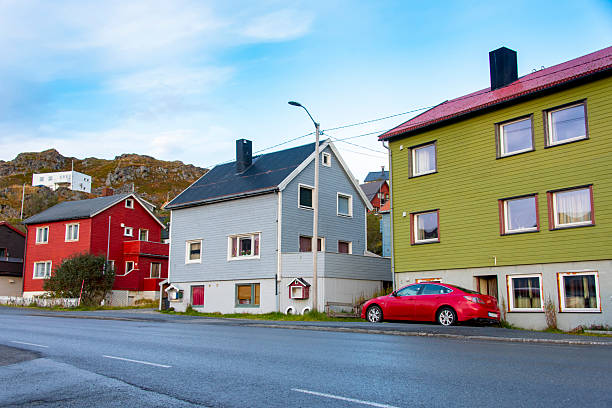Rag, Norway, August 25 - The warm colors of summer illuminate a typical norwegian red wooden house in Rag region, 50 kilometers east of the city of Stavanger, in southern Norway.