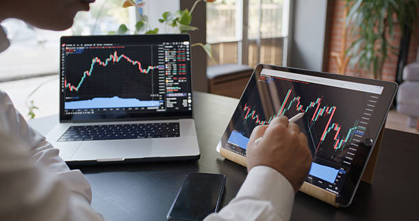 istock Man Checking His Stock Market Exchange Investment Using Using TradingView 2225777709