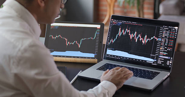istock Man Checking His Stock Market Exchange Investment Using Using TradingView 2225777884