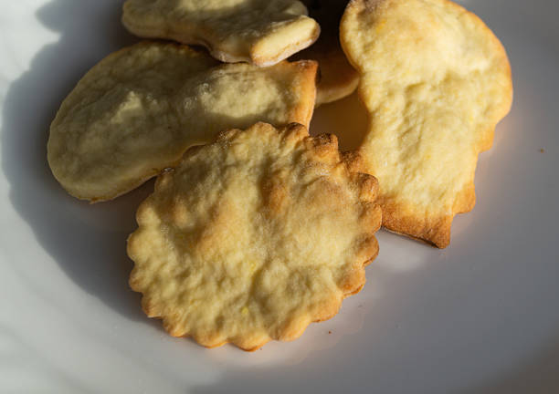 istock Potato chips on a white plate. A pile of chips on a white plate in the sunlight 2225779488