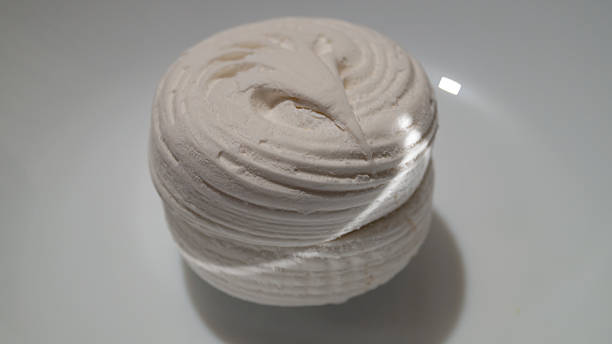 istock Large white marshmallows in a round shape on a white plate 2225779535