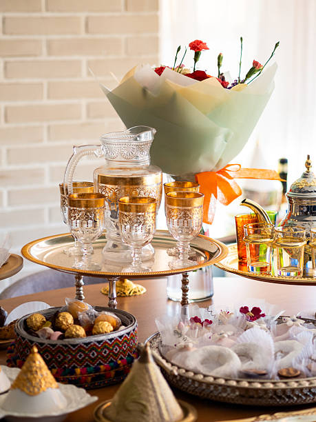 istock Elegant table with traditional Arabic sweets and decorative glassware for festive occasion 2225780241