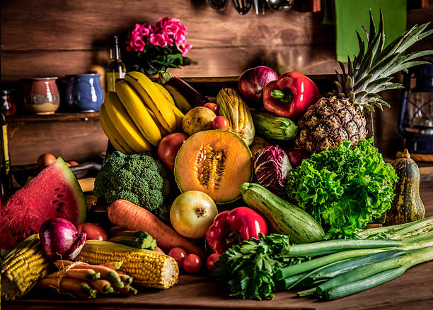 istock Cutting board in a rustic kitchen ready to cut and process organic tropical fruits and vegetables. Natural lighting 2225781803