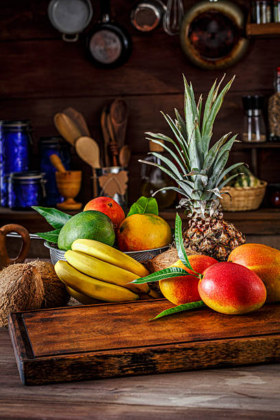 istock Cutting board with organic tropical fruits in old fashioned rustic kitchen 2225781840