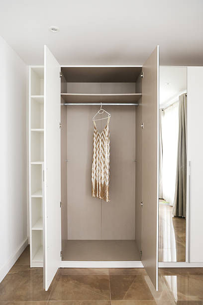 istock Open Wardrobe with Hanging Dress 2225782256
