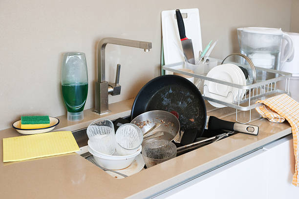istock Dirty Dishes in Kitchen Sink 2225782502