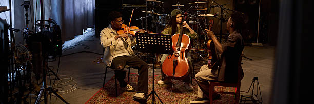 istock Multiethnic Musicians Playing String Instruments during Music Rehearsal 2225783944