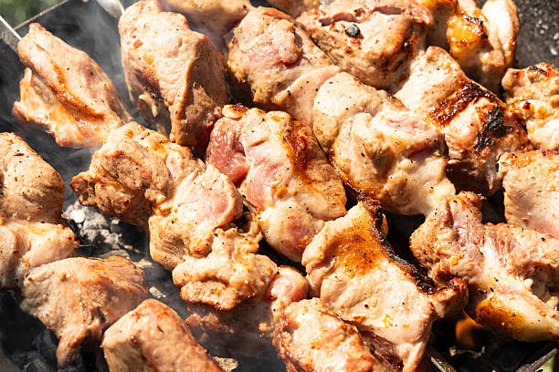 Close-Up Of Meat Grilling On Barbecue