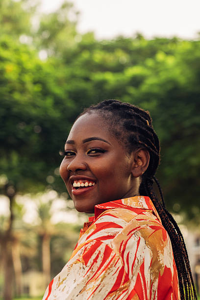 istock Joyful Woman Smiling Outdoors in a Bright Colored Apparel 2225786368