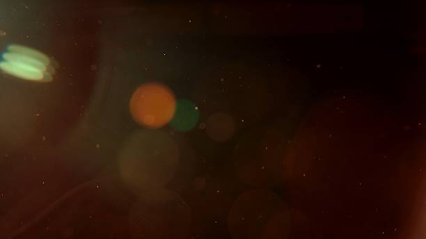 istock Warm glowing dust particles in golden light 2225787968