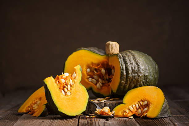 istock Sliced green pumpkin with bright orange flesh 2225789930