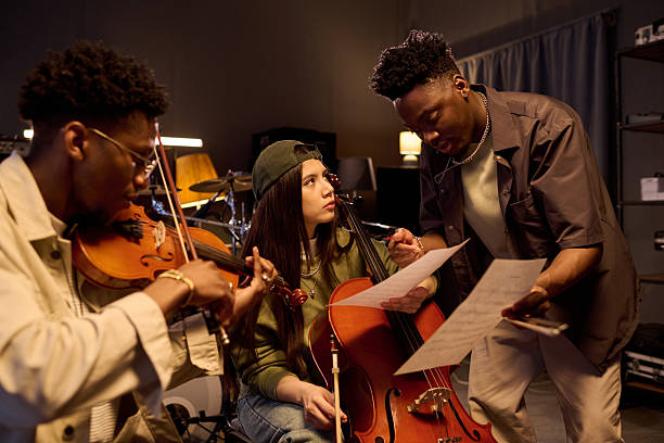 istock Multiethnic Musicians Rehearsing Classical Music Together in Studio 2225789935