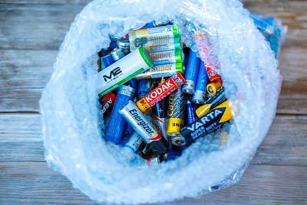 large collection discarded batteries, proper battery recycling and disposal, issue electronic waste, discarded power cells, Environmental concern, Green initiative, Frankfurt, Germany - July 4, 2025