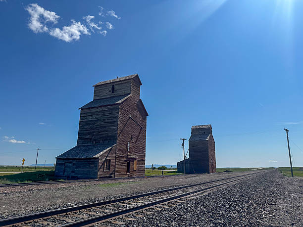 istock Old Wooden Grain Elevator Beside Railroad Tracks 2225791778