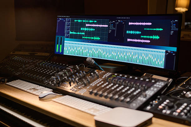 istock Audio Engineer Mixing Tracks on Professional Studio Soundboard Equipment 2225793223
