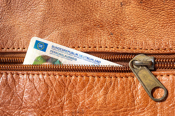 istock German ID card in brown leather wallet with EU flag, Modern European personal document, European integration and legal rights, EU citizen travel, passport control border, foreign travel 2225797147