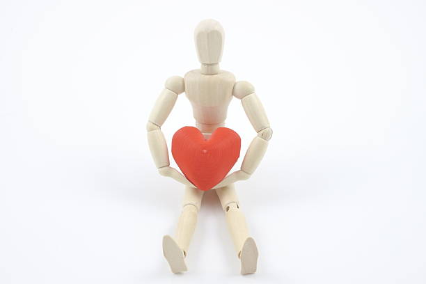 istock Doll holding a heart, warmth, gentle heart. 2225798029