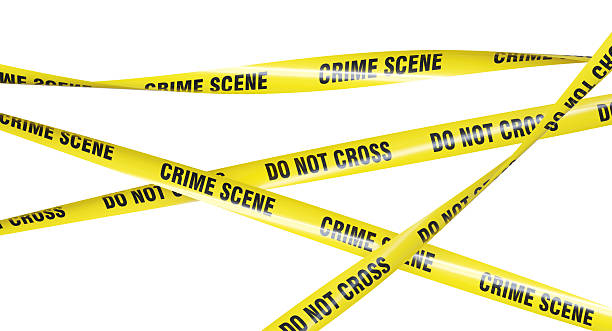 istock Crime scene tapes restricting access to area 2225802661