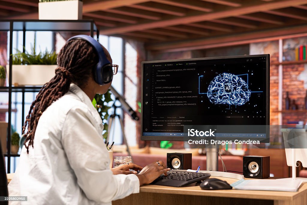 Software Developer Typing On Pc Keyboard Wearing Headphones Using Ai ...