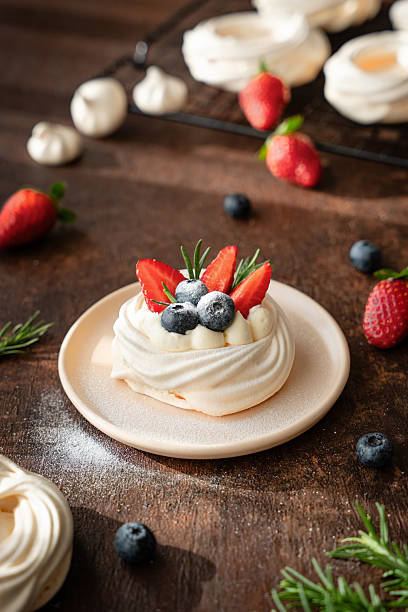 Summer Pavlova Dessert with Berries and Cream Topping Powdered Sugar